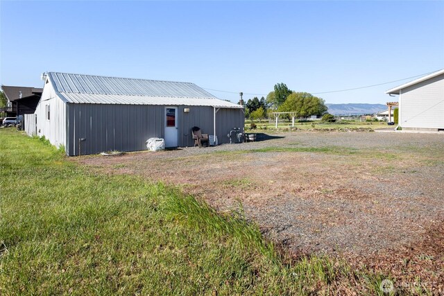 2710 Willowdale Rd, Ellensburg, WA 98926 - view of grassy yard with an outdoor structure and an outbuilding