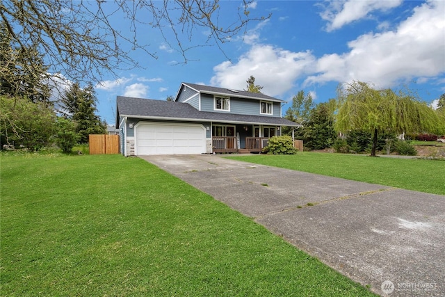 traditional-style house featuring a garage, fence, covered porch, a front yard, and driveway