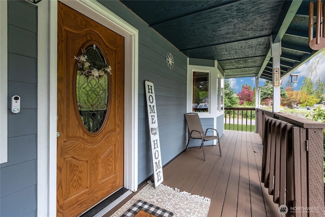 doorway to property featuring covered porch