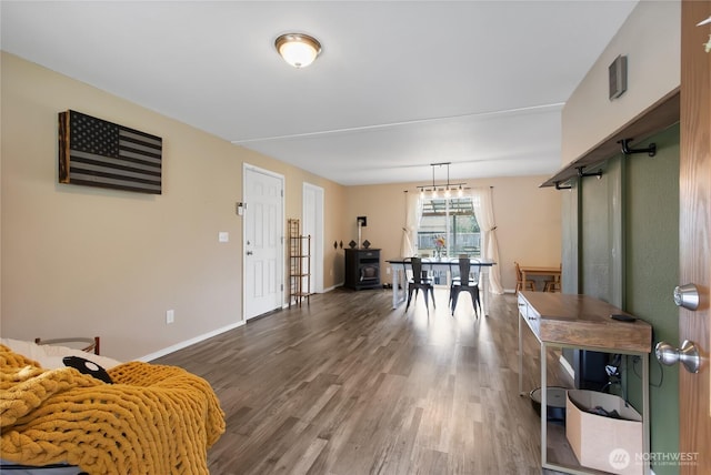 interior space featuring baseboards and wood finished floors
