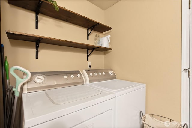 washroom featuring independent washer and dryer and laundry area