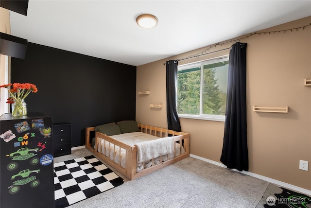 carpeted bedroom with baseboards