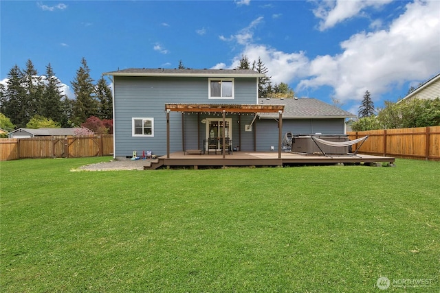 back of house featuring a fenced backyard, a pergola, a yard, and a deck
