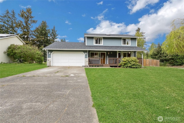 traditional-style home with an attached garage, a front lawn, covered porch, and driveway