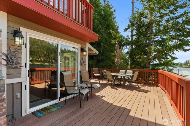 wooden deck with outdoor dining space