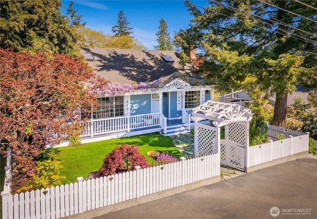 obstructed view of property featuring covered porch and a shingled roof