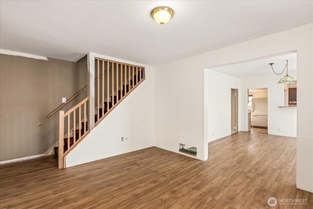 interior space with stairs and wood finished floors