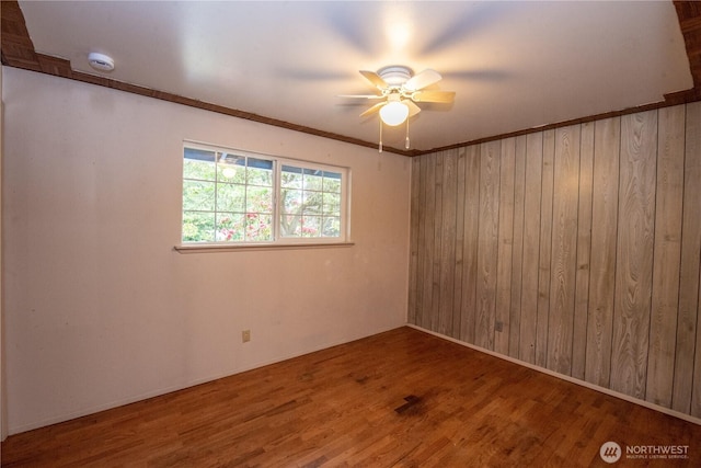 2916 SW 329th St, Federal Way, WA 98023 - empty room with a ceiling fan, wood finished floors, wooden walls, and a smoke detector