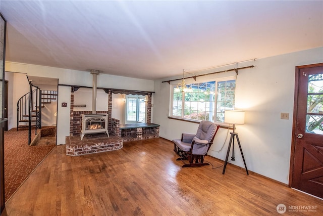 2916 SW 329th St, Federal Way, WA 98023 - living area featuring wood finished floors, stairway, and a wood stove