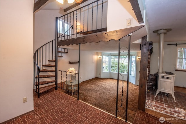 2916 SW 329th St, Federal Way, WA 98023 - stairs featuring a wood stove, brick patterned flooring, and plenty of natural light