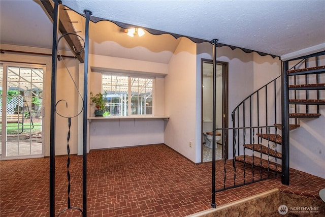 2916 SW 329th St, Federal Way, WA 98023 - stairs featuring a textured ceiling, carpet flooring, and plenty of natural light