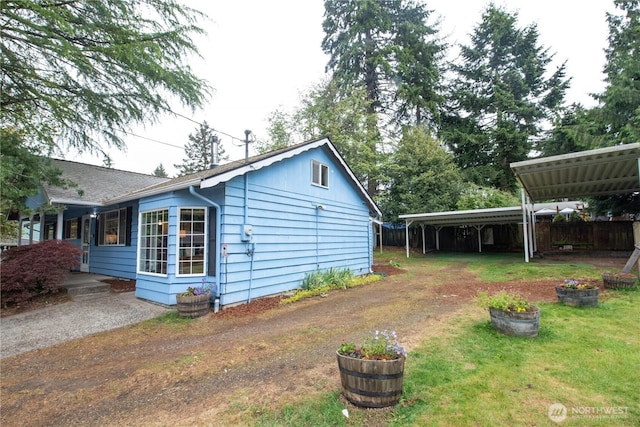 2916 SW 329th St, Federal Way, WA 98023 - view of side of property featuring a yard and a carport