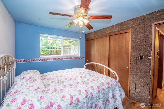 2916 SW 329th St, Federal Way, WA 98023 - bedroom featuring a closet, wood finished floors, and ceiling fan