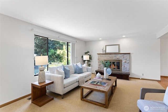 living room with a fireplace, baseboards, recessed lighting, and light colored carpet