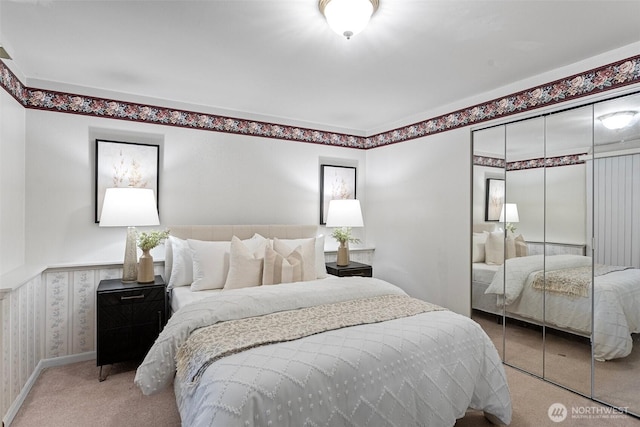 carpeted bedroom featuring a closet