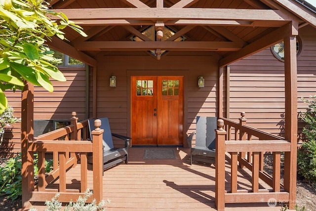 property entrance with a deck