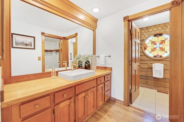 bathroom featuring vanity and wood finished floors