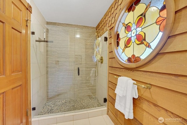 bathroom featuring tile patterned flooring and a shower stall