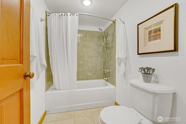 full bath featuring toilet, tile patterned floors, baseboards, and shower / bath combo with shower curtain