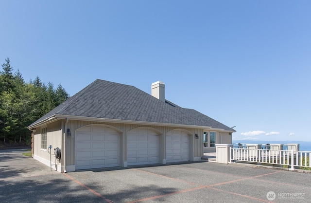 581 Harbor View Dr, Port Angeles, WA 98363 - view of front of property featuring roof with shingles and a chimney