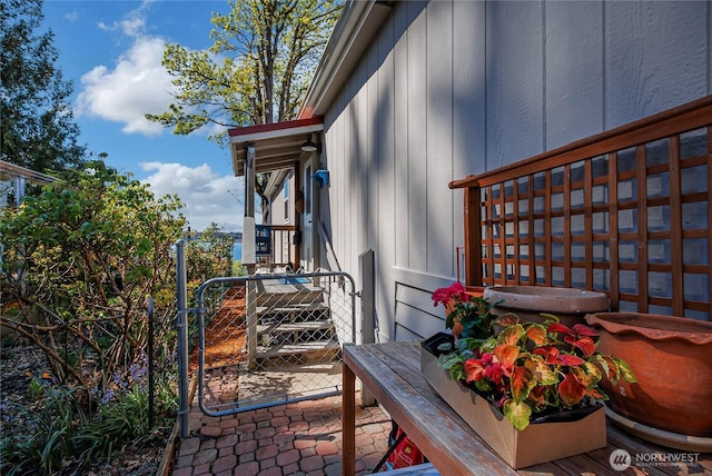 view of side of property with a gate and fence