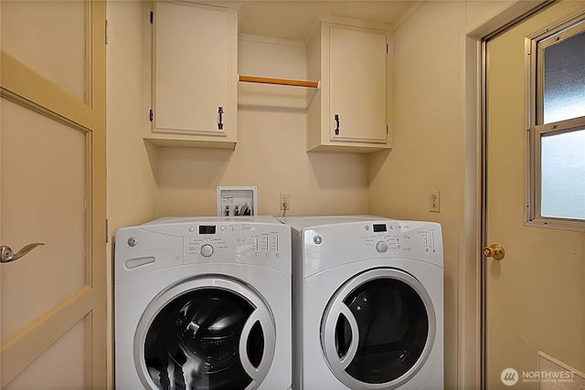 laundry room with cabinet space and washer and dryer