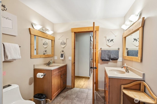 251 Kachess River Rd, Easton, WA 98925 - bathroom featuring tile patterned flooring, two vanities, toilet, and baseboards