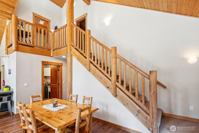 251 Kachess River Rd, Easton, WA 98925 - dining room with stairs, wood ceiling, wood finished floors, baseboards, and high vaulted ceiling