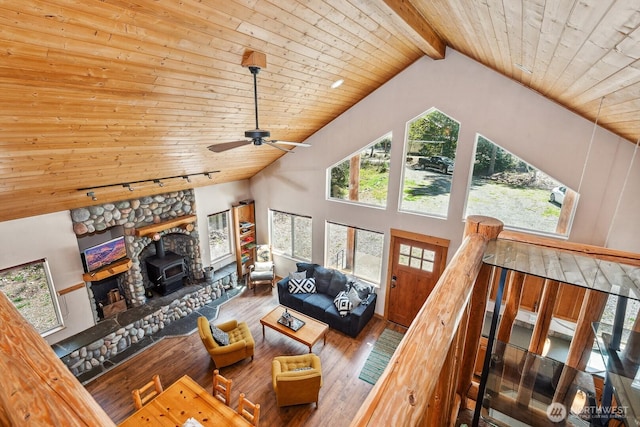251 Kachess River Rd, Easton, WA 98925 - living area featuring wooden ceiling, wood-type flooring, a wood stove, rail lighting, and high vaulted ceiling
