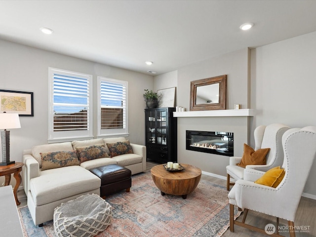 20352 132nd St SE, Monroe, WA 98272 - living area with a glass covered fireplace, recessed lighting, and wood finished floors