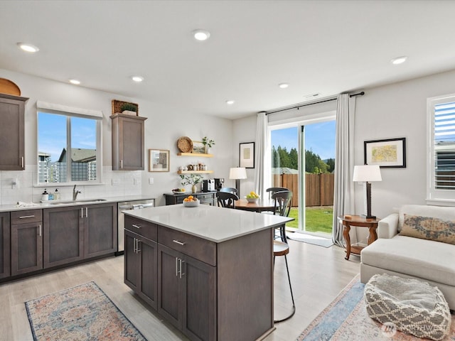 20352 132nd St SE, Monroe, WA 98272 - kitchen featuring plenty of natural light, a sink, a kitchen breakfast bar, and dishwasher