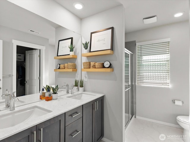 20352 132nd St SE, Monroe, WA 98272 - bathroom featuring baseboards, a sink, a stall shower, and visible vents