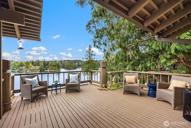 wooden deck with a water view