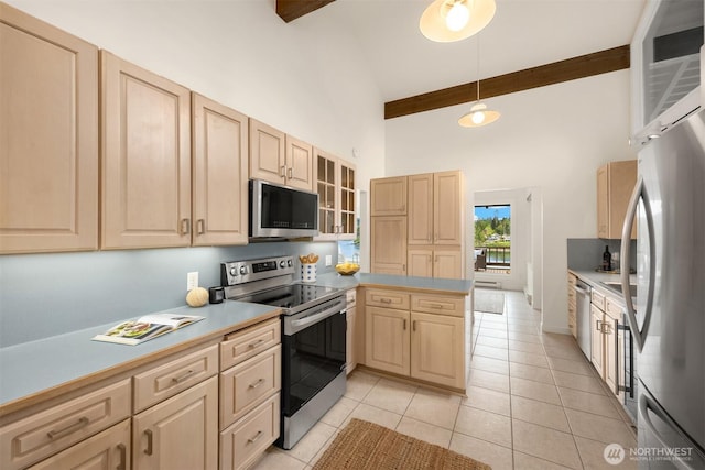 kitchen featuring beam ceiling, light brown cabinets, high vaulted ceiling, stainless steel appliances, and a peninsula