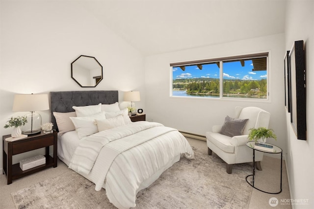 carpeted bedroom featuring a baseboard radiator and lofted ceiling