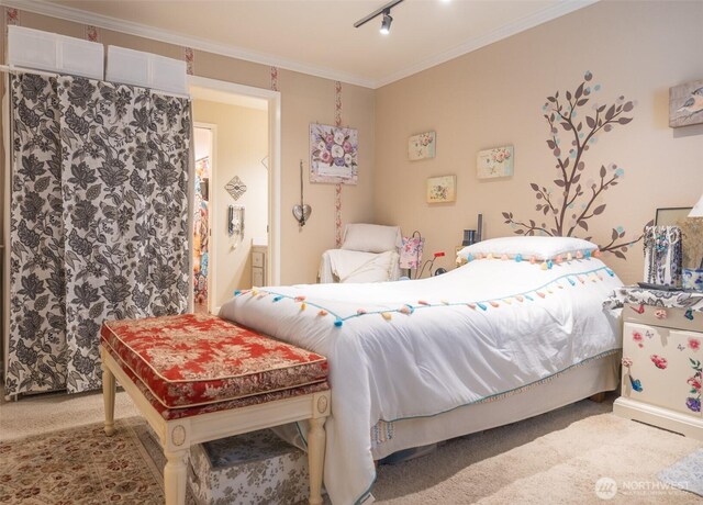bedroom featuring carpet flooring and ornamental molding
