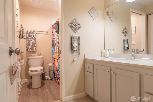 full bathroom with vanity, toilet, baseboards, wood finished floors, and a shower with curtain