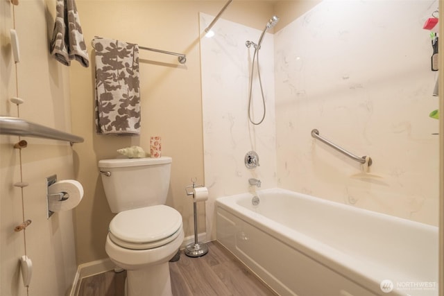 full bathroom with toilet, baseboards, tub / shower combination, and wood finished floors