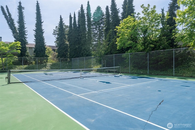 view of sport court with fence