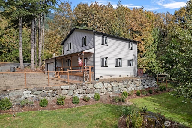 10871 Alfred St, Rockport, WA 98283 - exterior space featuring a front lawn, crawl space, a garage, and fence