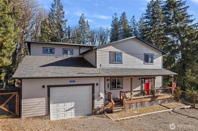 10871 Alfred St, Rockport, WA 98283 - traditional-style home featuring a porch, fence, a shingled roof, a garage, and driveway
