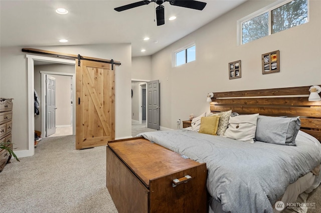 10871 Alfred St, Rockport, WA 98283 - bedroom featuring recessed lighting, light colored carpet, a barn door, ceiling fan, and baseboards