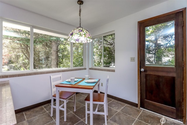dining room with baseboards