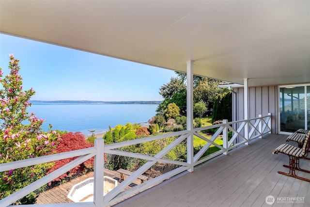 deck featuring a water view