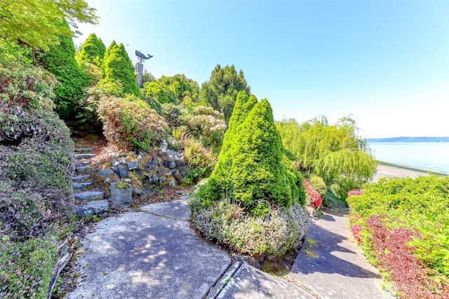 view of patio with a water view