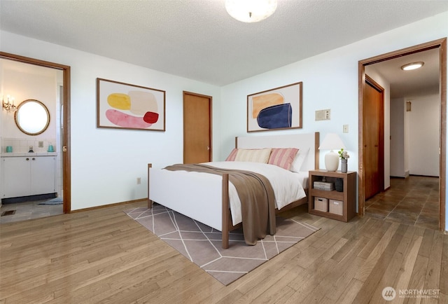 bedroom with light wood finished floors