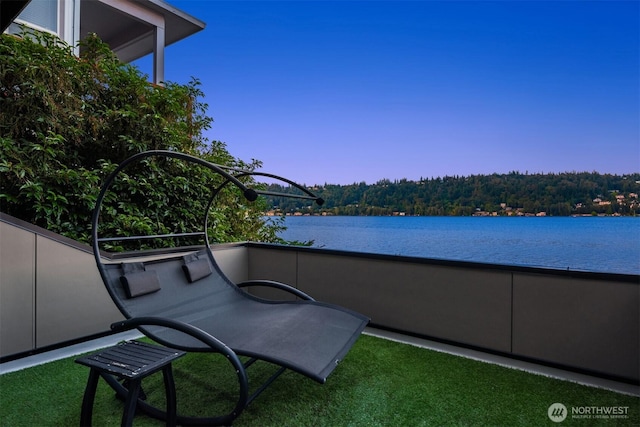 balcony featuring a water view