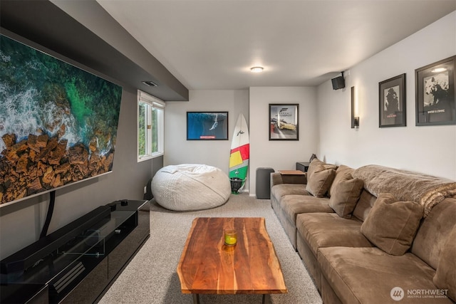 living room featuring carpet, baseboards, and visible vents