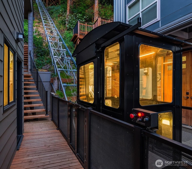 view of side of property featuring stairway