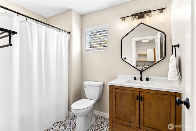 bathroom with vanity, tile patterned flooring, toilet, baseboards, and a shower with shower curtain